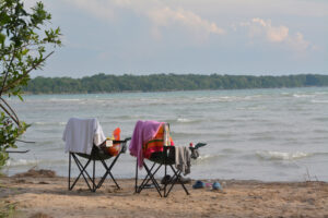 "Enjoying the View: Outlet River, Sandbanks" - Peggy deWitt