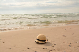 "Hat on the Beach:  Sandbanks Beach" - Peggy deWitt